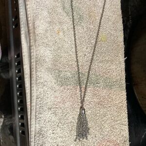 Sterling silver with a tassel
